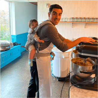 Tomas and his child cooking cookies